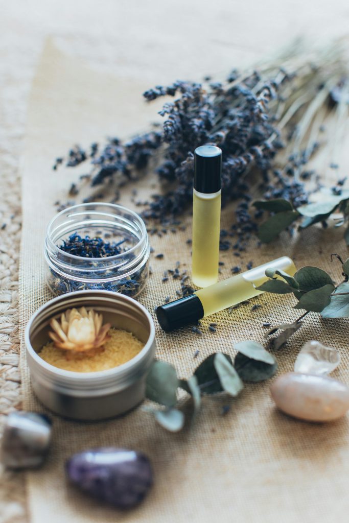 Aromatherapy in Glasgow, Scotland. This image features aroma oils, Amethyst stones and Lavender. 